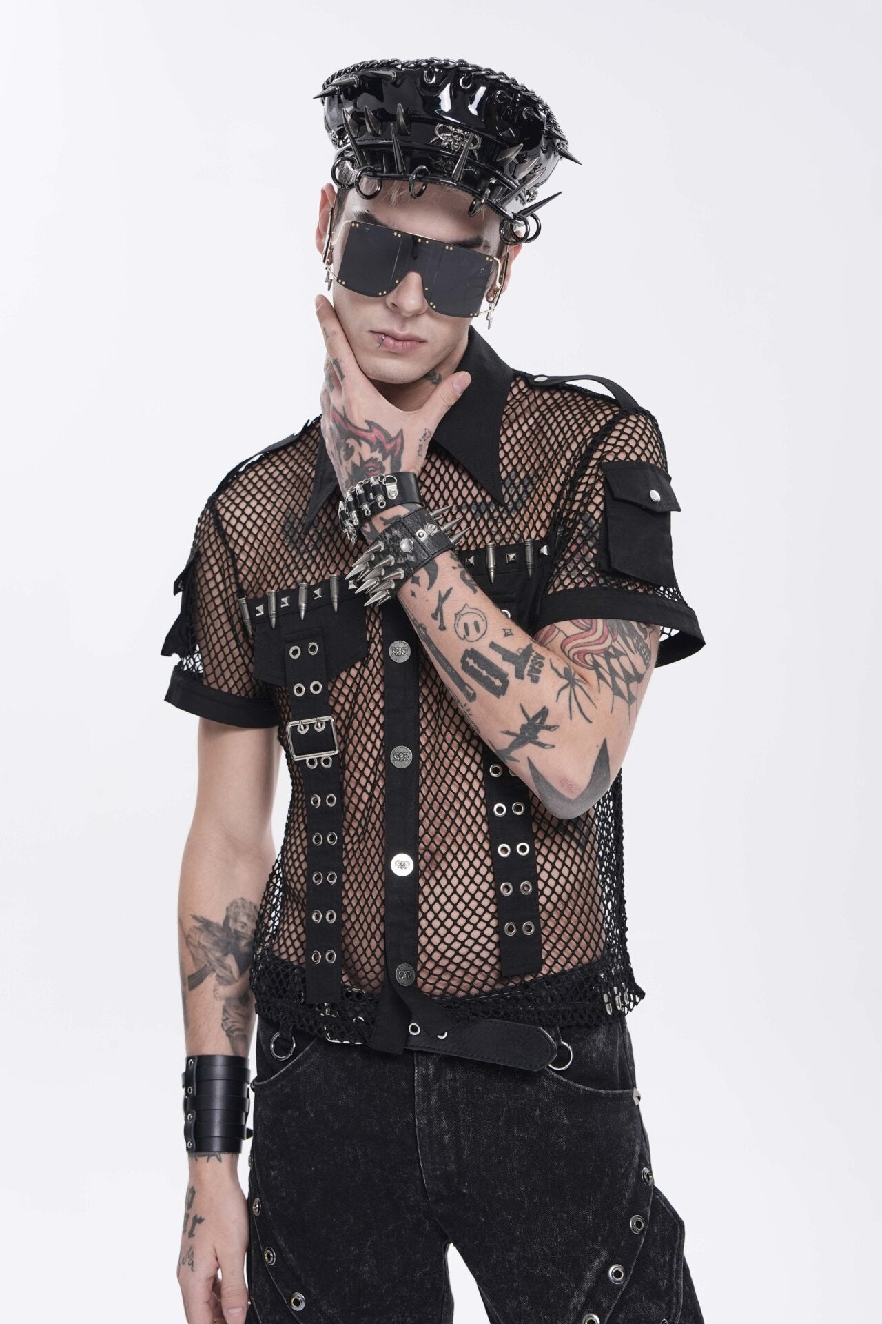 Black spiked headpiece with synthetic leather and metal details.