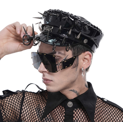 Black spiked headpiece with synthetic leather and metal details.